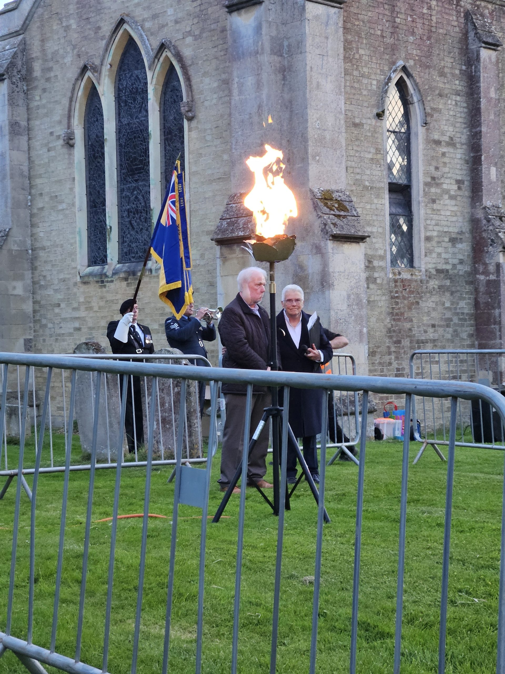 Freeman, Roy Reeves and Chair S Withams standing for a moments silence following the lighting of the beacon. 
